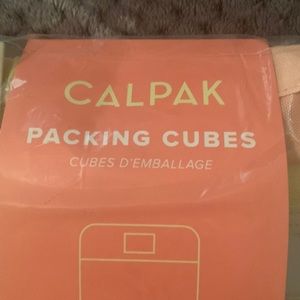 Calpak set of 3 packing cubes. Never been opened!